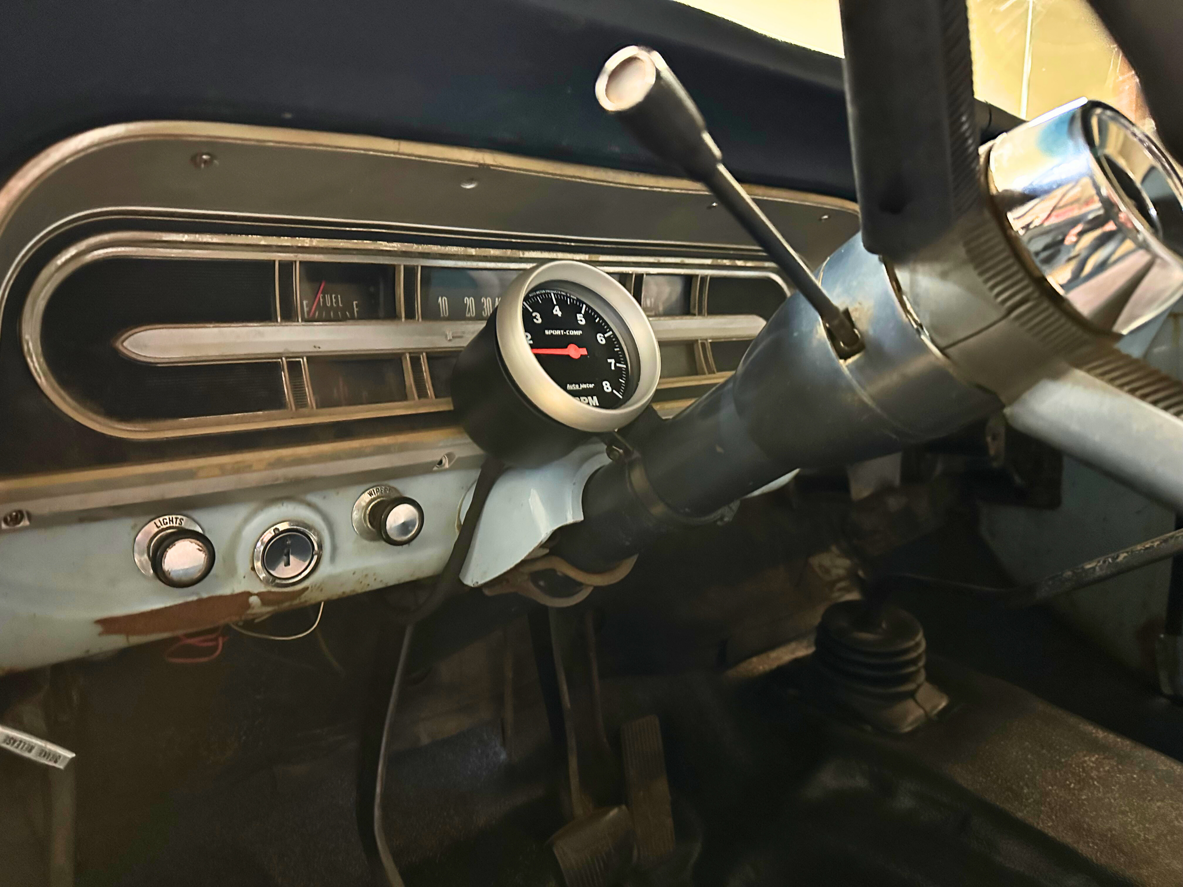 A gauge mount installed in an old F100 truck