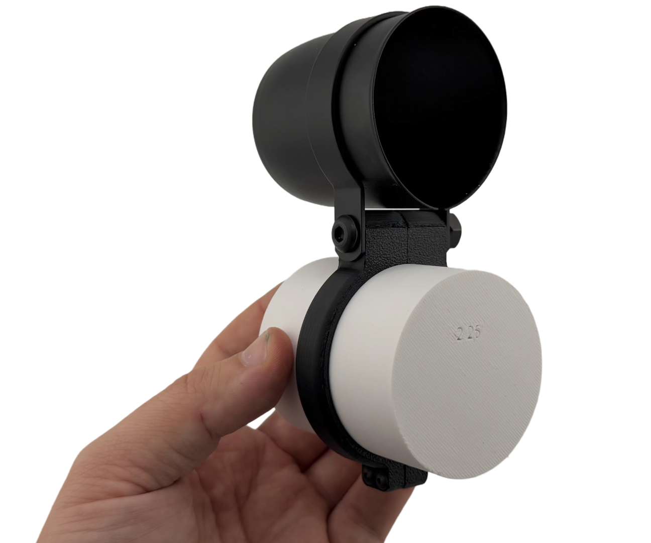 A hand holding a gauge clamp with a gauge cup on top. Universal steering column mount that fits 2.25 inch steering columns